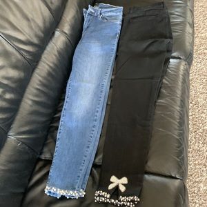 Two pairs of Frank Lyman cropped denim one in black and other a mid wash